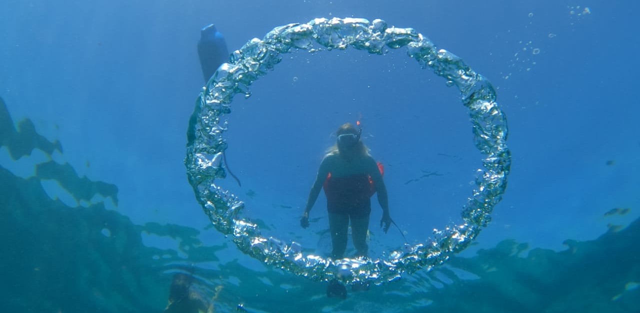 Snorkeler above a bubble ring during a Caño Island snorkeling tour from Drake Bay